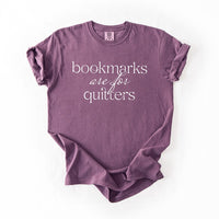 Flat lay of berry “Bookmarks Are for Quitters” book lover tee – cozy heavyweight reading t-shirt