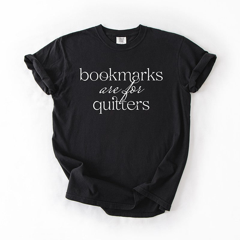 Flat lay of black “Bookmarks Are for Quitters” tee – funny bookish graphic tee for readers