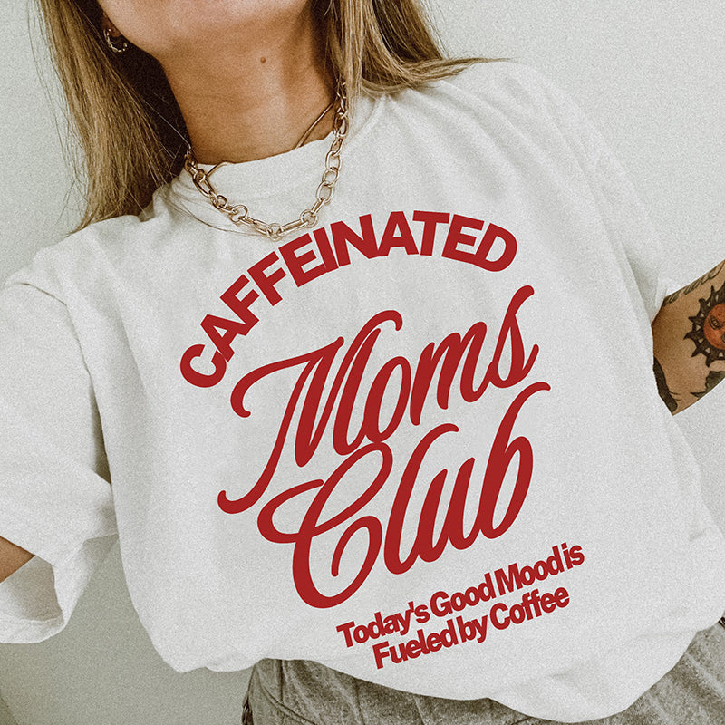 Model wearing Caffeinated Moms Club tee in white — funny coffee shirt for moms