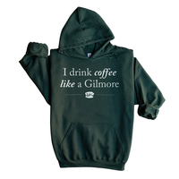 Flat lay of forest green Gilmore Girls coffee hoodie – unisex pullover with drawcord and kangaroo pocket