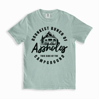 Flat lay of bay Drunkest Bunch of Assholes camping tee — relaxed fit party shirt for summer