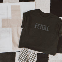 lded Feral Graphic Tee in black, showcasing heavyweight fabric and muted grey print.