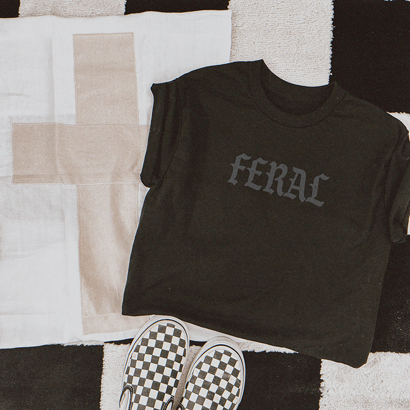lded Feral Graphic Tee in black, showcasing heavyweight fabric and muted grey print.