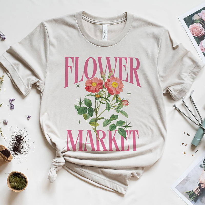 Flat lay of Flower Market tee in dust — soft unisex floral print t-shirt