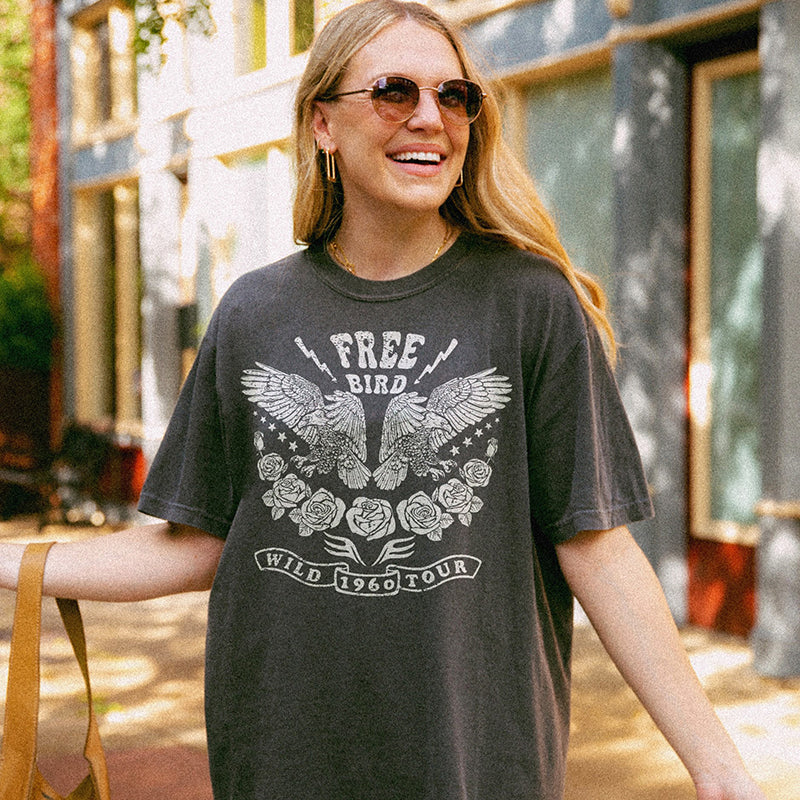 Model wearing Free Bird tee in pepper — edgy, rock n’ roll-inspired t-shirt