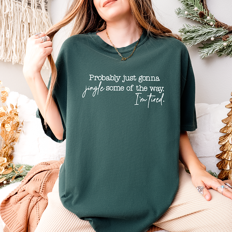 Woman wearing blue spruce “Probably Just Gonna Jingle Some of the Way” tee – funny tired Christmas shirt for women