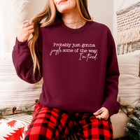 Woman wearing maroon Bella Canvas holiday sweatshirt with sarcastic Christmas quote – cozy unisex fleece pullover