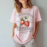 Model in blossom Locally Grown tee — soft pink summer tee with vintage produce style