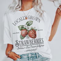 Model wearing Locally Grown Strawberries tee in white — summer farmers market graphic t-shirt