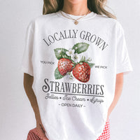 modeled photo of white tee — relaxed fit strawberry graphic shirt for women