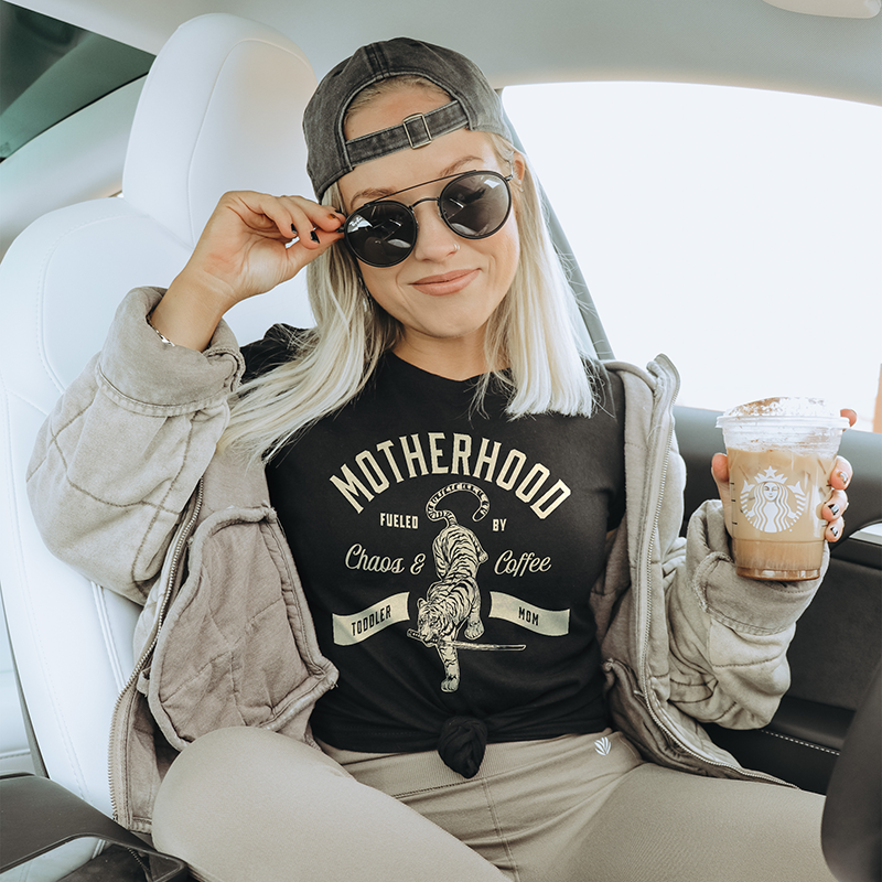 Model styled in lightweight black motherhood tee — soft coffee and chaos shirt for women