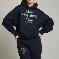Model wearing matching navy Slow Mornings Club hoodie and sweatpants lounge set
