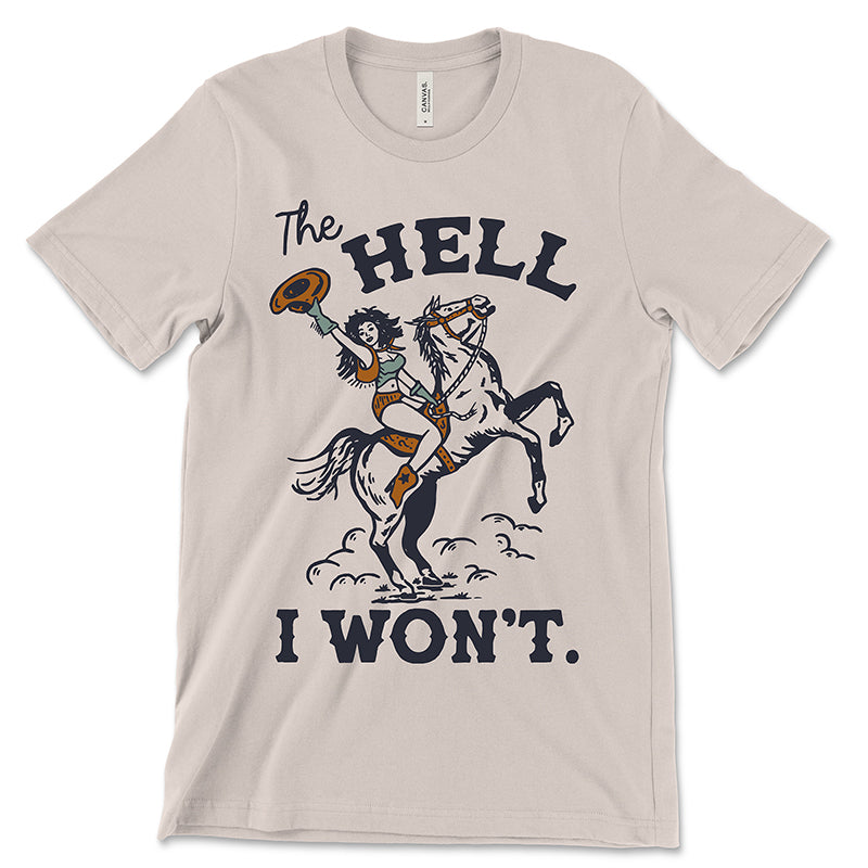 Flatlay of “The Hell I Won’t” lightweight cowgirl tee on neutral background, showing western graphic and soft cotton fabric.