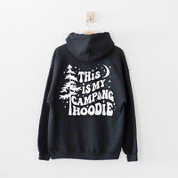 Flat lay of black hoodie showing back graphic — unisex camping hoodie for men and women