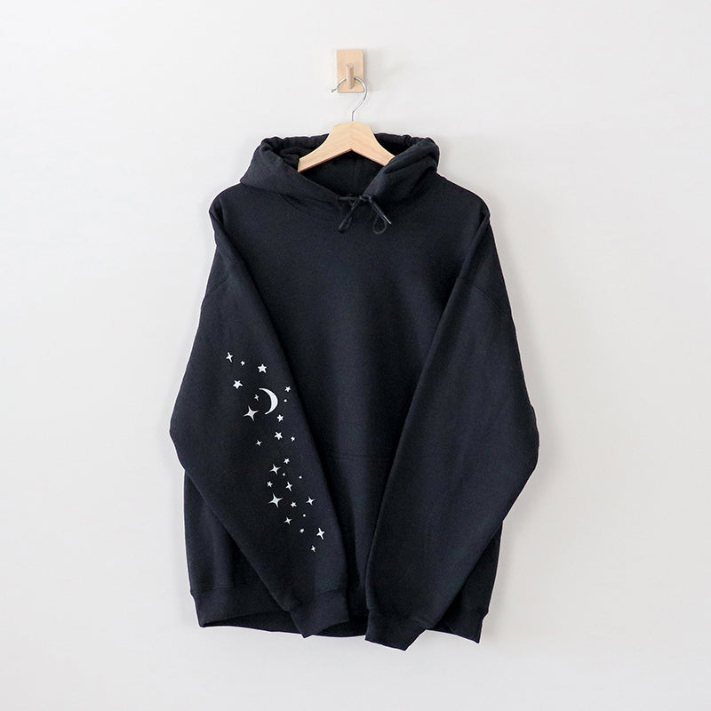 Flat lay of black hoodie sleeve — funny printed sleeve design for camping sweatshirt