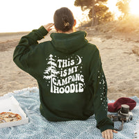 Model in forest green camping hoodie — cozy unisex camping sweatshirt