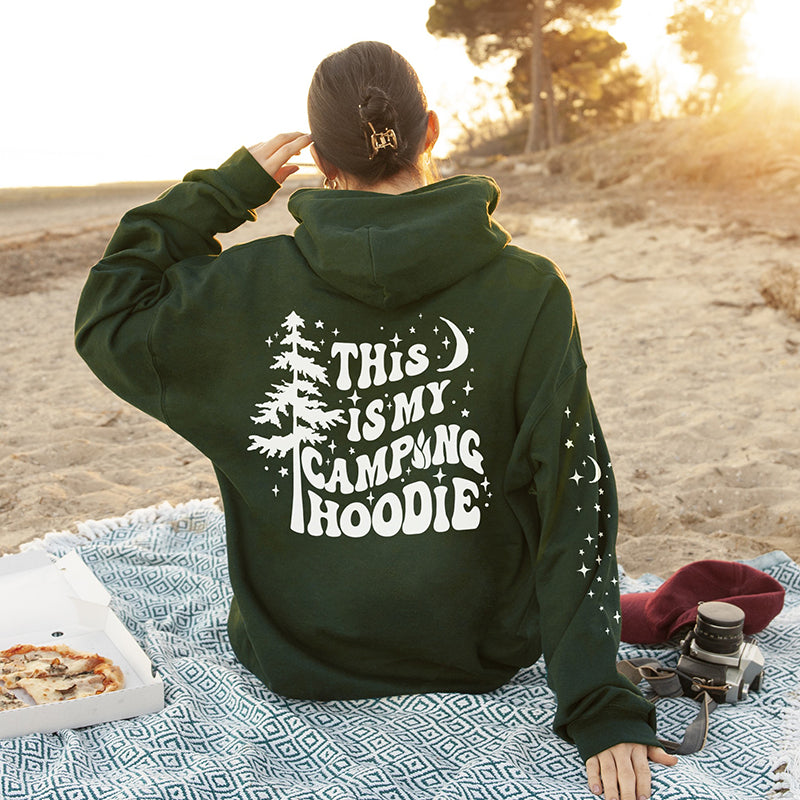 Model in forest green camping hoodie — cozy unisex camping sweatshirt