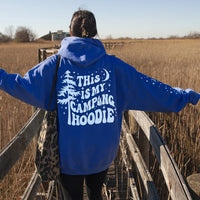 Model wearing royal blue camping hoodie — relaxed fit graphic hoodie with sleeve and back print