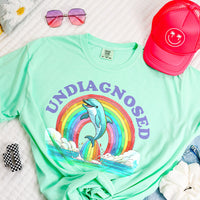 Flat lay of Island Reef Undiagnosed tee — pastel heavy cotton funny t-shirt