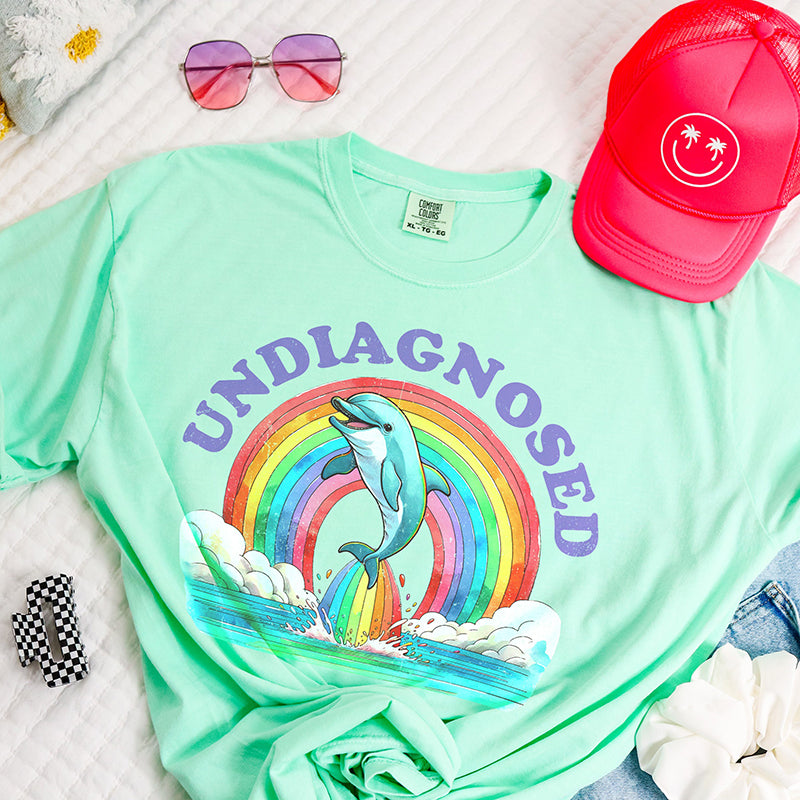 Flat lay of Island Reef Undiagnosed tee — pastel heavy cotton funny t-shirt