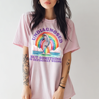 Model in blossom Undiagnosed tee — colorful mental health humor shirt for women