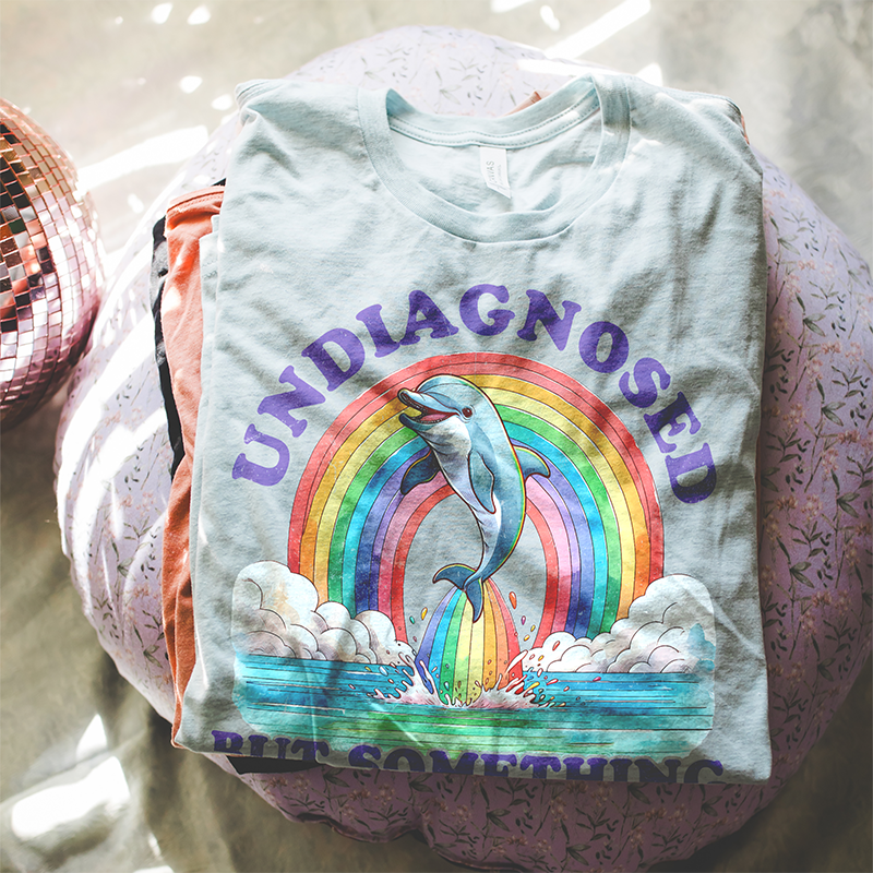 Flat lay of ice blue lightweight Undiagnosed tee — buttery soft funny summer t-shirt