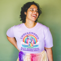 Model wearing lilac Undiagnosed lightweight tee — pastel soft graphic tee for summer