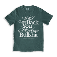 Flat lay of the Wait Come Back You Forgot Your Bullshit tee in blue spruce – bold white text on vintage-style unisex Comfort Colors shirt.