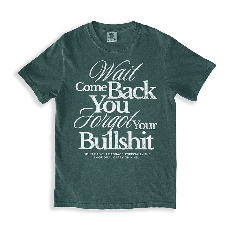 Flat lay of the Wait Come Back You Forgot Your Bullshit tee in blue spruce – bold white text on vintage-style unisex Comfort Colors shirt.