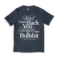 Flat lay of the Wait Come Back You Forgot Your Bullshit graphic tee in midnight – soft heavyweight cotton with bold white text.