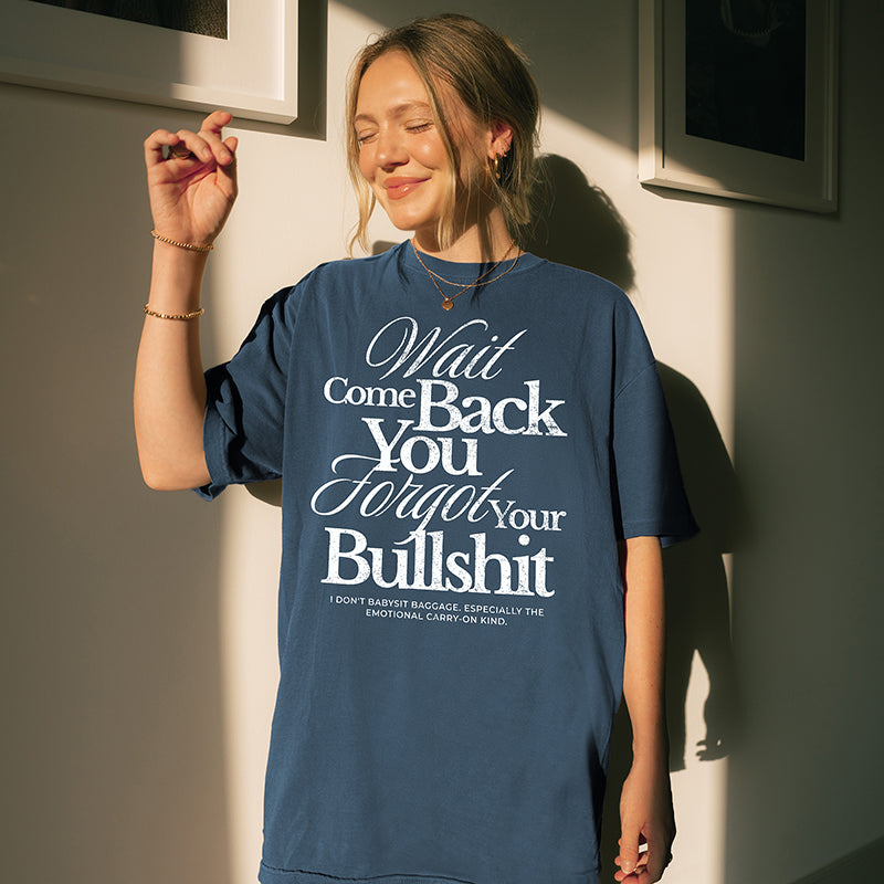 Model wearing the Wait Come Back You Forgot Your Bullshit tee in midnight – relaxed fit Comfort Colors shirt with bold statement graphic.